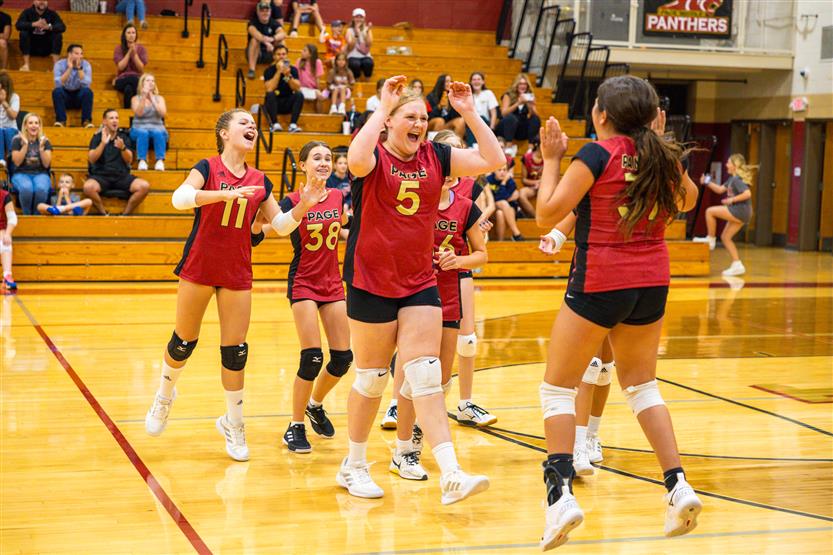 Student-athletes play volleyball